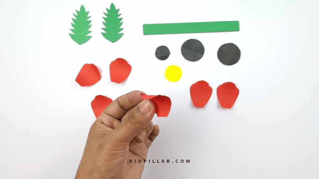 Make slits on the outer edge of the petals and curl them inside using a pencil or scissors.